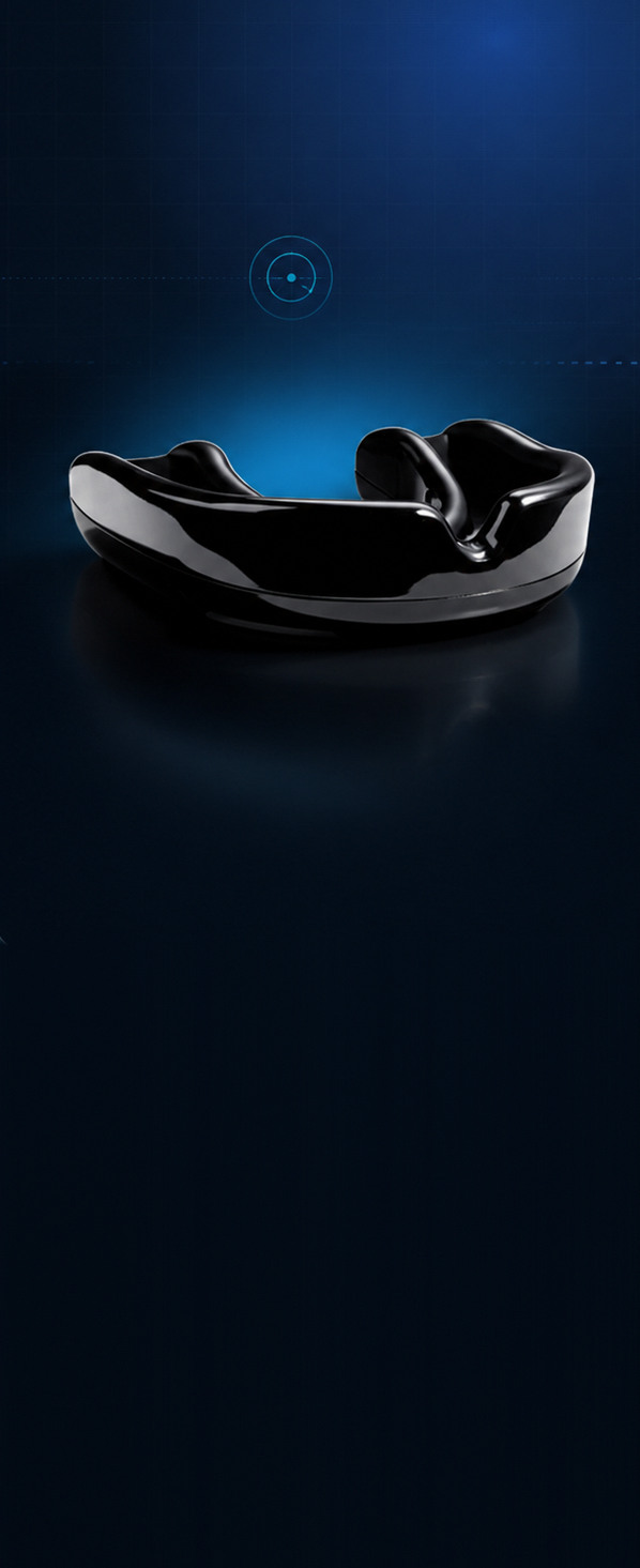 A glossy black custom-fitted sports mouth guard, photographed on a dark blue background.